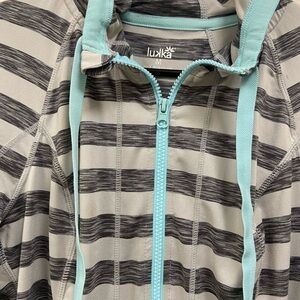 Luka athletic top jacket. Front Zipper. Grey & white striped.  Size medium.